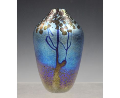 A Norman Stuart Clarke iridescent glass vase, dated 1982, decorated with two stylized trees, engraved marks to footrim, heigh