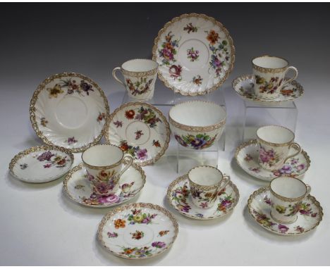 A matched Dresden porcelain part service, first half 20th century, painted and printed with floral sprays beneath gilt rims, 