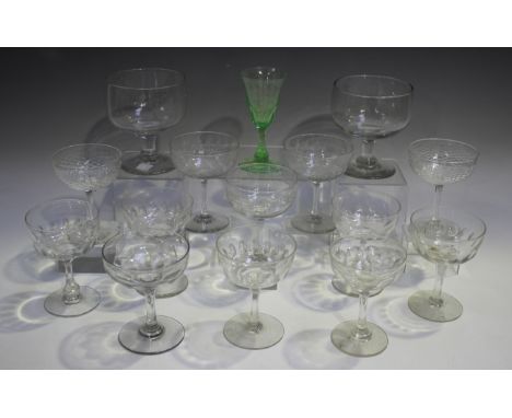A pair of glass champagne saucers, early 20th century, engraved with fern leaves, height 11.5cm, together with another pair w
