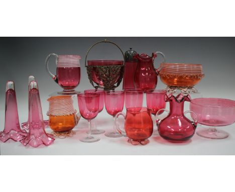 A small group of mostly cranberry coloured glassware, late 19th century and later, including five wines with clear stems and 