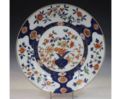 A Meissen circular dish, circa 1740, painted in Imari style after a Japanese original, probably by Kretschmar, in underglaze 