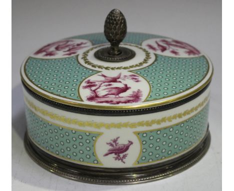 A French silver mounted Sèvres porcelain circular box and cover, 19th century, painted in puce camaïeu with panels of birds w