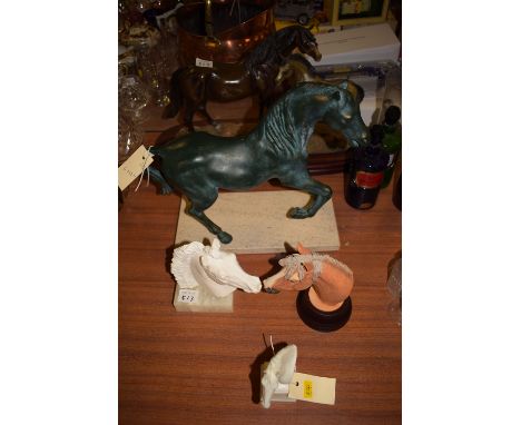 A Royal Worcester 'Pyrobis' horse's head; together with two other horses heads; a modern brass model of a horse on a granite 