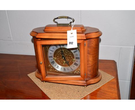 A West German walnut cased modern mantel clock by Rapport.
