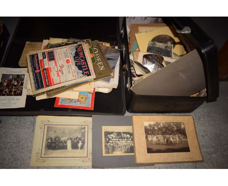 A suitcase containing a large collection of old topographical photographs, portrait and family photographs, etc; and a folder