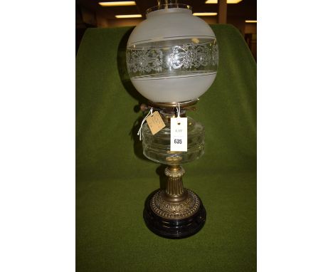 A Victorian glass oil lamp, by Dietz Davis & Co. Ltd., London, associated opaque clear and etched shade, on brass column.