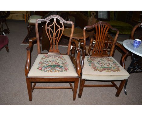 Two George III mahogany open armchairs with woolwork tapestry seats.