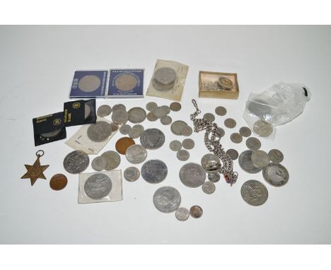 A quantity of coinage, including: commemorative crowns; together with a silver watch chain.