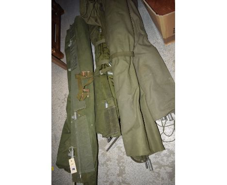 Four army canvas folding camp beds.