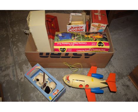 A Sindy camping buggy and fold-away tent; a Casdon Mini Scales, Mini Cash toy set; and a Pelham Puppet 'Snoopy'.