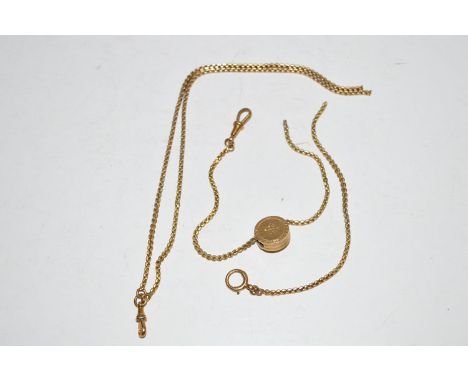 A broken yellow metal chain, the mount of circular form with black enamel, seed pearl and ruby set design, stamped to clasp '