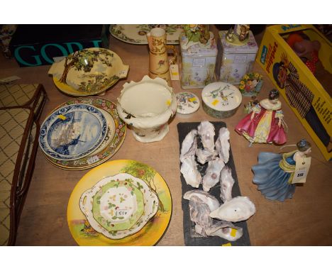 Two Royal Doulton figurines "Adrienne" HN2304 and "Southern Belle" HN2229; a Royal Worcester tall cyndrical jug with floral d