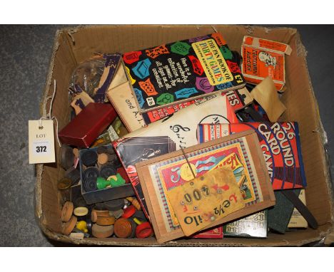 A box containing miscellaneous chess, draughts and dominoes pieces; playing cards; books on Party Games; etc.