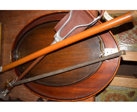 A large oval mahogany tray; a stained oak tray with brass handles; a shooting stick; a riding crop; together with a bamboo sw