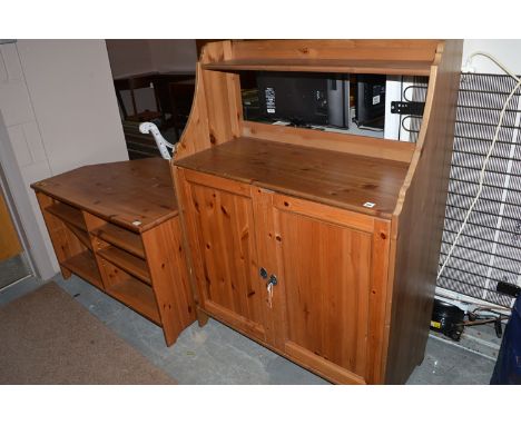 A stained pine television stand with fitted shelves; together with a side cabinet fitted shelf above a pair of panel doors.  