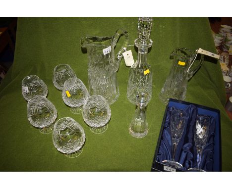 Cut glass ware, to include: six brandy balloons; a decanter; two jugs; a pair of Stuart Crystal champagne flutes; and a Palom