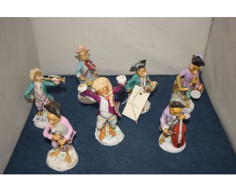 A set of seven Continental monkey musicians playing instruments.
