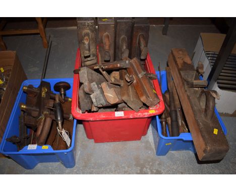 A quantity of wooden planes; block planes; hand drills; and moulding planes, chisels and assorted hand tools; in three boxes.