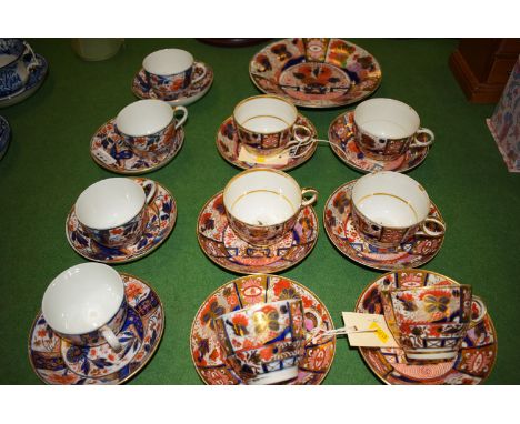 An early 19th Century part tea set in the Imari colours, comprising of: six cups, six saucers, a plate; with similar four cup