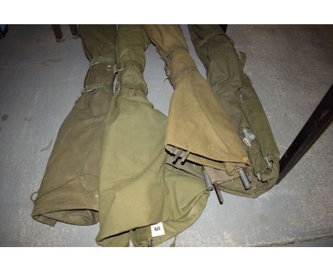 Four army canvas folding camp beds.