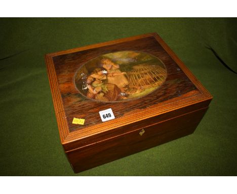 A Victorian rosewood sewing box, boxwood stringing, lithograph cartouche, bone escutcheon, opening to reveal fitted interior.