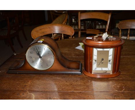 A mantel clock by Hermle, with silvered arabic dial; together with another by Franz Hermle & Son.  (2)