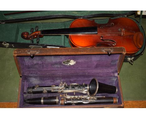 A clarinet with no maker's marks: together with a modern Chinese violin, in fitted case.