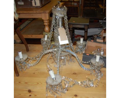 A cut crystal glass hanging five light electrolier, with shaped and notch faceted branch arms, approx drop 60cm.Width 78cm.In