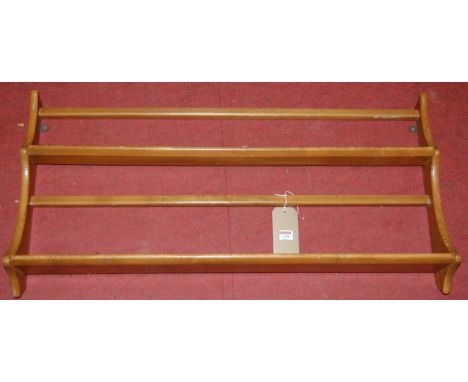 An Ercol light elm two-tier wall mounted plate rack, width 96.5cm