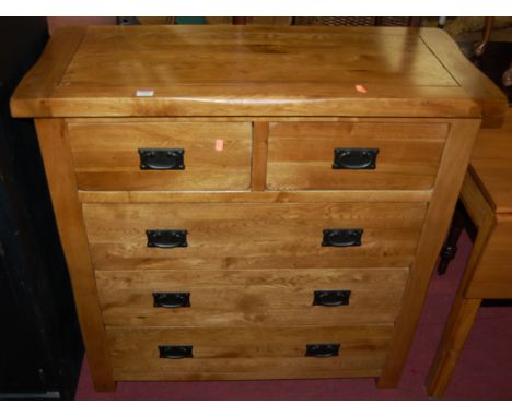 A contemporary joined light oak square front chest of two short over three long drawers, width 98cm