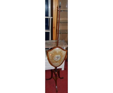 A 19th century mahogany and satinwood strung pole screen, having shield shaped silk inset decorated panel; together with a Vi