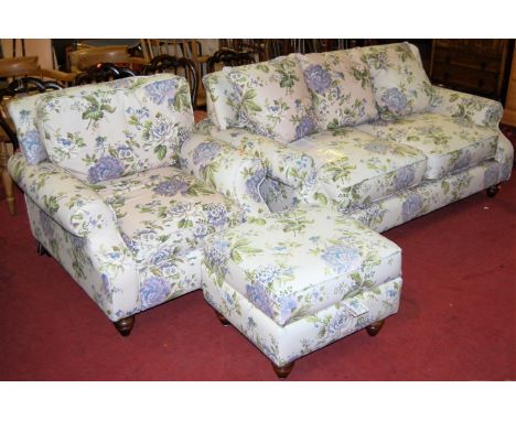 A contemporary DFS Ellie range floral upholstered three piece suite comprising; two-seater sofa, single armchair, and hinge t