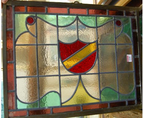 A pair of brass framed lead lights (formerly windows) each 57x44cm; and a single unframed lead light (3)