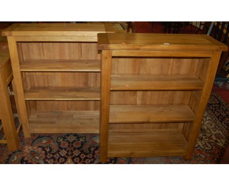 A pair of contemporary joined light oak freestanding open bookshelves, width 89cm