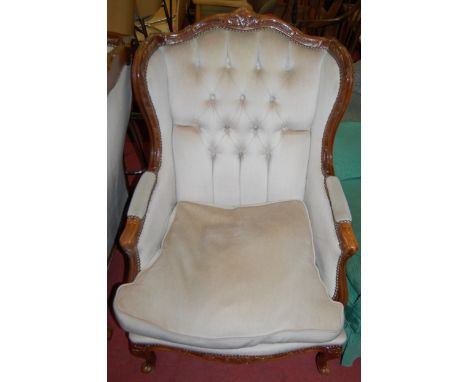 A pair of contemporary French style hardwood and button back upholstered wing back armchairs in the Louis XV taste, width 70c