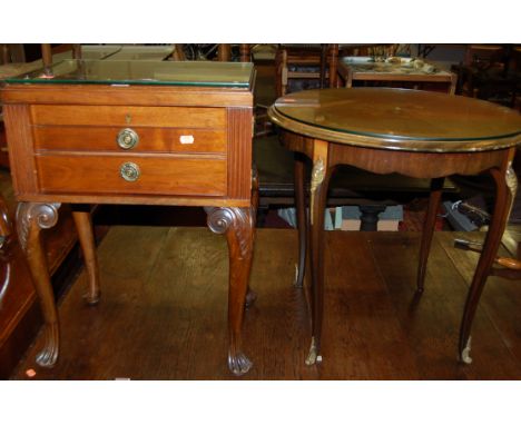 An early 20th century mahogany hinge-topped canteen of cutlery table, raised on acanthus leaf cabriole supports (lacking cont