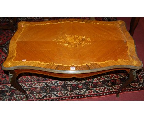 A French satinwood inlaid shaped top low occasional table, on gilt metal mounted cabriole supports, length 100cm