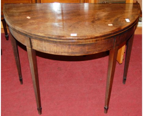 An early 19th century mahogany and crossbanded D-shaped fold-over baize lined card table, w.91cm; together with a 19th centur