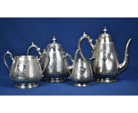 An unusual Victorian silver plate four piece coffee &amp; tea service of pear shape form , the main bodies with engine-turned