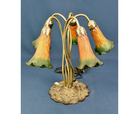 A Tiffany style five light table lamp with orange and green flower shades. 