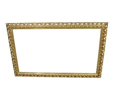 A large modern bevelled mirror with pierced foliate and beaded surround. 33 x 57ins ( 83.8 x 144.7cm)  
