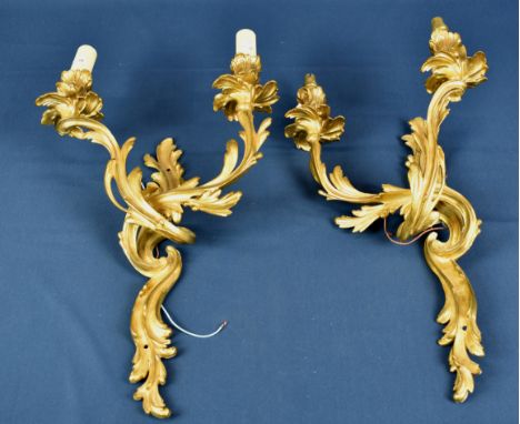 A pair of gilt metal rococo style light fittings.  