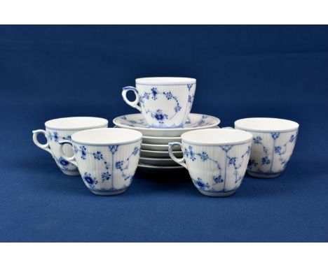 A set of six Royal Copenhagen cups and saucers painted in underglaze blue in 'Onion' pattern, green printed and blue painted 