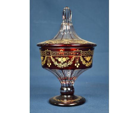 A Victorian ruby flash covered vase with gilt decoration.  