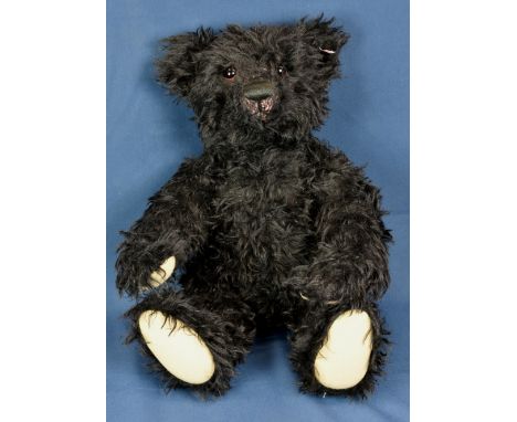 A Steiff Othello Titanic replica teddy bear in black mohair with Steiff tag to ear and growler. 