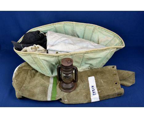A canvas desert bath, army tent and three canvas barrel bags and a tropic lantern (6) 