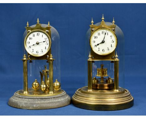 Two brass anniversary clocks with glass domes early to mid 20th century, one signed Gustav Becker, both having single train m