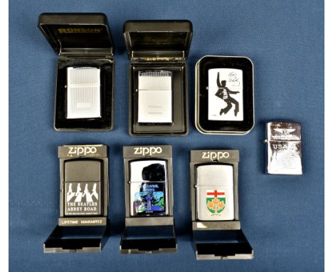 Four commemorative Zippo lighters including a Beatles 'Abbey Road' lighter, c.1996; an Elvis Presley lighter, c.2002; and two