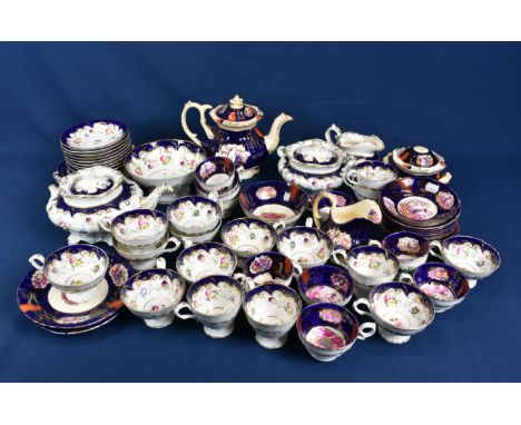 A 19th century English porcelain part tea service decorated with a tulip design together with another part tea service (qty) 