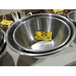Deep stainless steel mixing bowls.